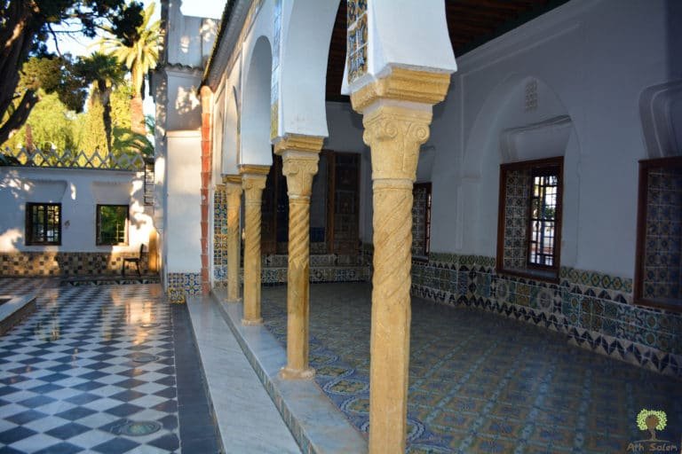Columns and a chequered floor, with planting let into the corner.