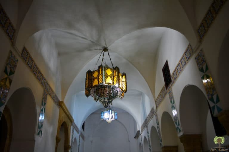 White vaulting and a single suspended lantern.