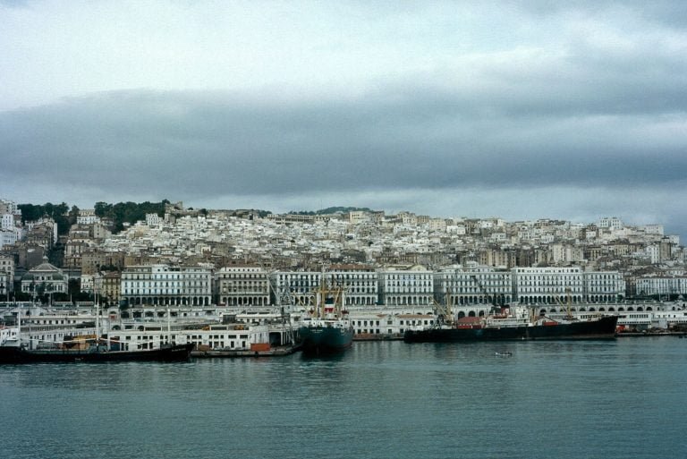 A historic photograph of the waterfront and the medina above it.
