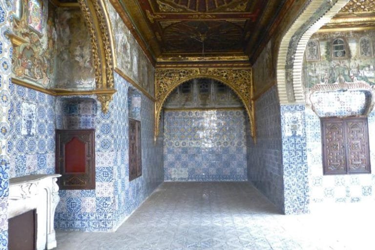 Blue and white tilework to the walls, painted timber above.